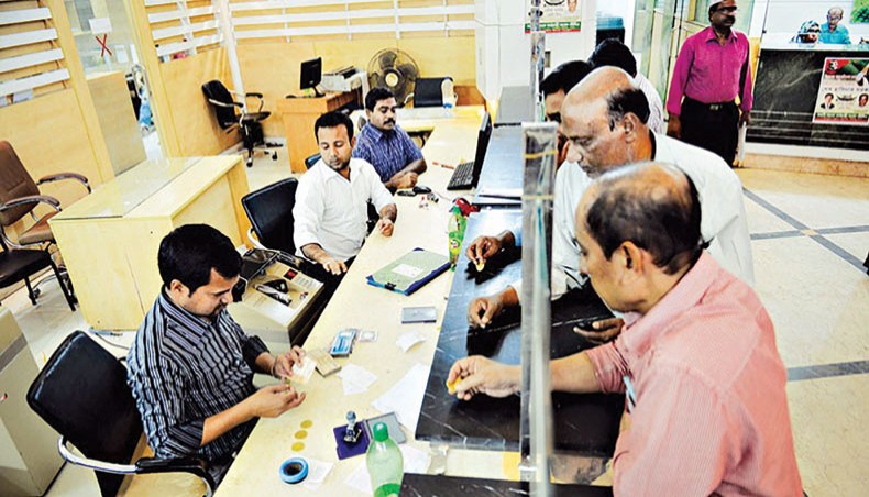 A file photo shows clients receiving services from officials inside a branch of a bank in Dhaka. The growth in credit, known as investments in Islamic banking, from the country’s Islamic banks and Islamic banking wings of traditional banks dropped to 9.02 per cent in the last fiscal year (2019-2020). — New Age photo