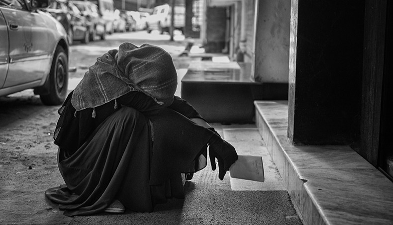 Exhausted, anxious, she is waiting in front of the IEDCR for a consult to see if she could get tested for COVID-19. She has breathing difficulty for the past 10 days. After much persuasion, she was able to see the doctor at IEDCR, who then referred her to Kurmitola Hospital, and told they will collect the sample as soon as possible for Covid-19 test. April 2, 2020. — Parvez Ahmed Rony/Drik