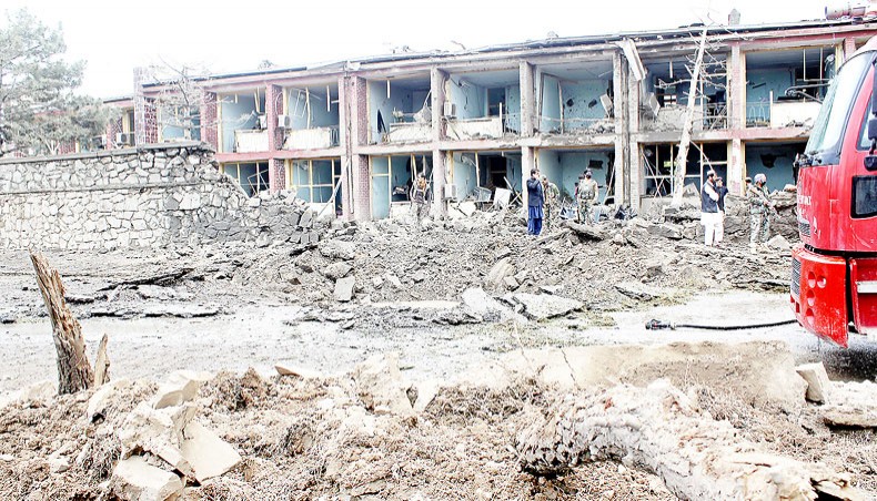 In this file photo, Afghan security personnel inspect the site of an attack on Afghan army base in Gardez, capital of Paktia province on May 14. — Agence France-Presse/STR