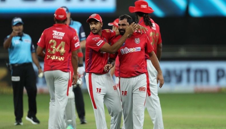 Kings XI Punjab pacer Mohammed Shami (R) celebrates with team-mates after guiding his team to victory in super over in their Indian Premier League match against Mumbai Indian in Abu Dhabi on Sunday. — Twitter photo