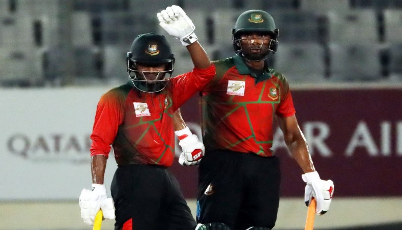 Mahmudullah XI batsman Mahmudul Hasan (L) celebrates his fifty as captain Mahmudullah looks on during their BCB President’s Cup match against Tamim XI at the Sher-e-Bangla National Stadium on Monday. — BCB photo