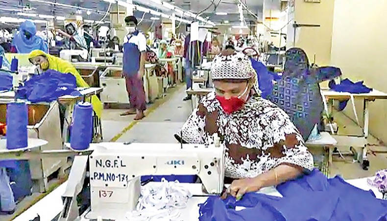 A file photo shows workers sewing clothes at a readymade garment factory in Dhaka. The country’s readymade garment sector workers’ representative has resigned from the tripartite committee formed to review labour rules alleging that the government was protecting the interest of owners in the amendments and ignoring the workers’ proposals. — New Age photo