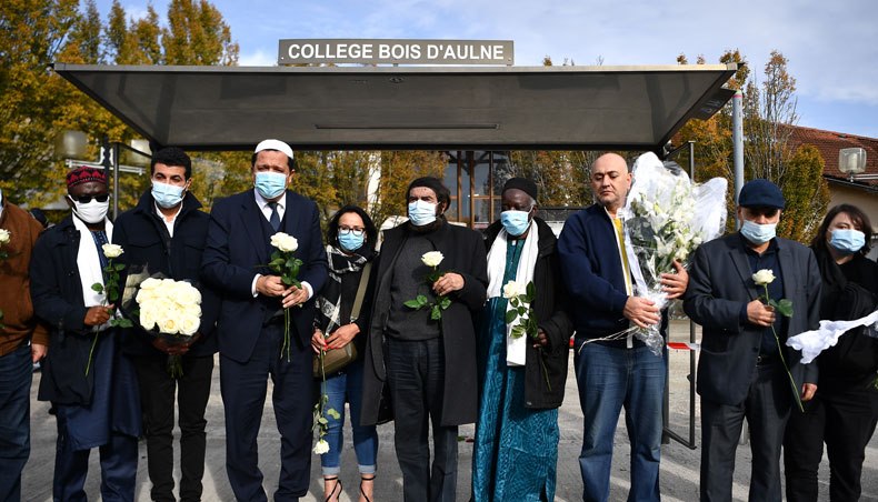 Imam of Drancy Hassen Chalghoumi and French Jewish writer Marek Halter attend a gathering of imams outside the Bois d’Aulne secondary school in homage to slain history teacher Samuel Paty, who was beheaded by an attacker for showing pupils cartoons of the Prophet Mohammed in his civics class, on October 19, 2020, in Conflans-Sainte-Honorine, northwest of Paris. — AFP photo