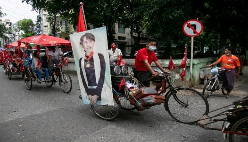 A trishaw driver decorated his vehicle with a picture of Aung San Suu Kyi attend a campaign for the National League for Democracy (NLD) party in Yangon on October 18, 2020.- AFP photo