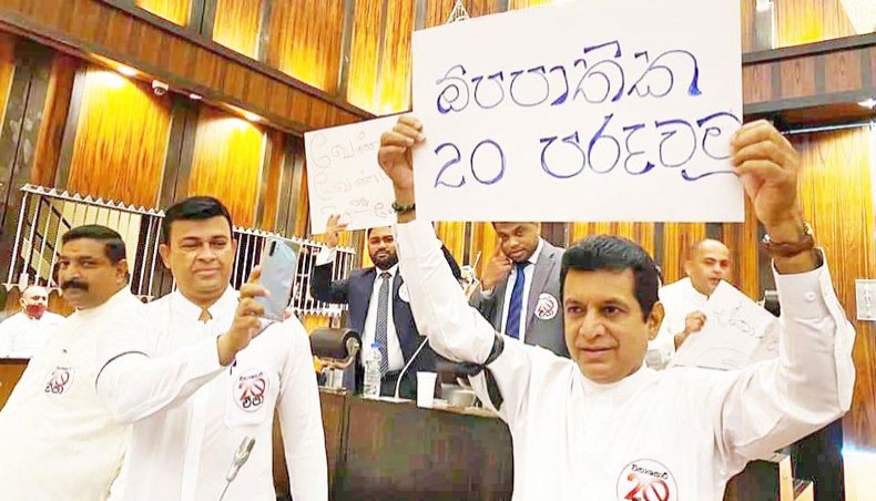 Sri Lankan parliamentarians protest against the 20th amendment to the constitution inside the parliament on September 22. — Zenger/Dammika Jayawardana