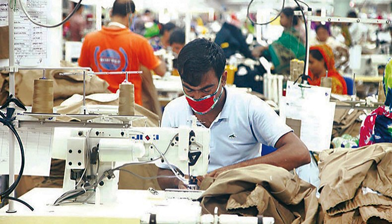 A file photo shows workers sewing clothes at a garment factory in Dhaka. Around 43 per cent of readymade garment factories in Bangladesh were operating with less than 50 per cent of their pre-pandemic total workforce as apparel exports to major destinations such as the European Union and the United States declined by nearly 35 per cent in the first half of 2020, according to a report of the International Labour Organisation. — New Age photo