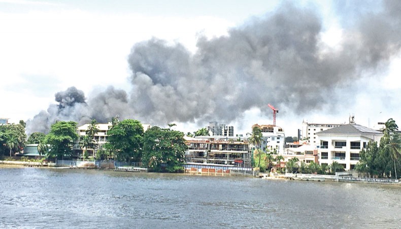 A general view of smoke arising from the Ikoyi prison that is on fire in Lagos on Thursday. — AFP photo