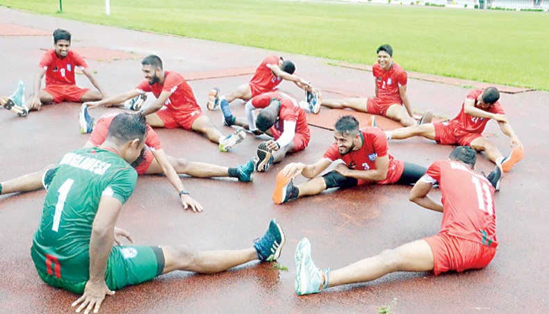 Members of the Bangladesh national football team stretch during a training session at the Bangabandhu National Stadium on Saturday. — BFF photo