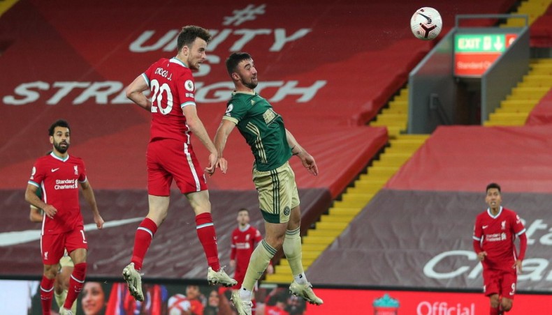 Liverpool striker Diogo Jota (2nd-L) heads the ball to score his team’s second goal against Sheffield United during their Premier League match at Anfield on Saturday. — AFP photo