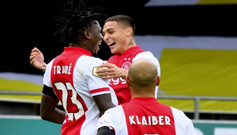 Ajax forward Lassina Traore (L) celebrates one of his five goals against VVV Venlo during their Eredivisie match at the Covebo stadium De Koel in Venlo on Saturday. — AFP photo