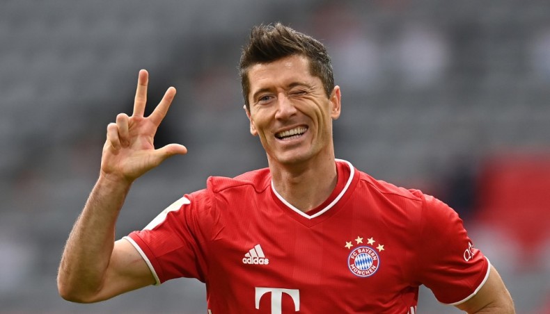 Bayern Munich forward Robert Lewandowski celebrates after completing his hat-trick during their Bundesliga match against Eintracht Frankfurt in Munich on Saturday. — AFP photo