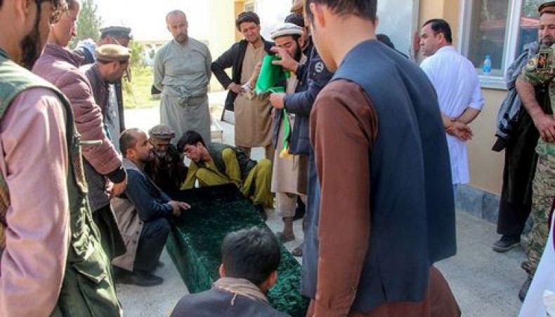 Relatives gather next to the coffin of a soldier outside a hospital after an ambush blamed on the Talibans killed at least 25 Afghan security force personnel as spiralling violence imperils ongoing peace talks, in Takhar province on October 21, 2020. — AFP photo