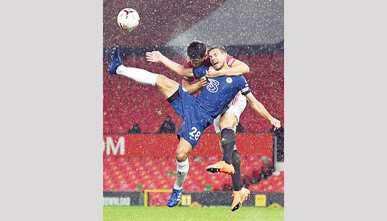 Cesar Azpilicueta in the air during their Premier League match at Old Trafford on Saturday. — AFP photo