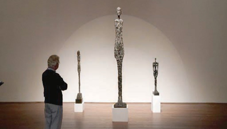 In this file photo a person looks at Alberto Giacometti’s ‘Grande femme I’ during a press preview at Sotheby’s October 23, 2020. — AFP photo