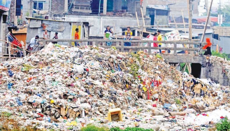 A New Age file photo shows a pile of wastes filling up a canal at Rasulpur at Kamrangirchar in Dhaka. — Indrajit Kumer Ghosh