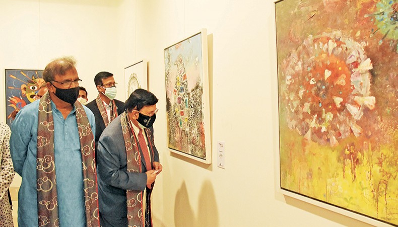 Foreign minister AK Abdul Momen and state minister for cultural affairs KM Khalid look at displayed artworks at the month-long group art exhibition Art Against Corona at Bangladesh Shilpakala Academy on October 27. — Press release