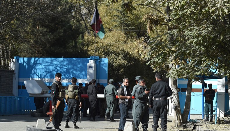 Police staff stand guard at an entrance gate of the Kabul University in Kabul on November 2, 2020. — AFP