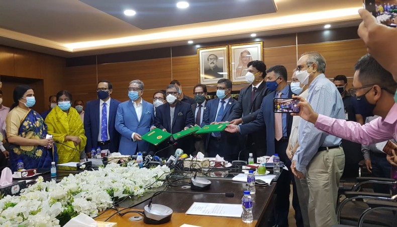 The health ministry on Thursday signs a tripartite contract with the Serum Institute of India and Beximco Pharmaceuticals for importing three crore doses of COVID-19 vaccine, developed by Oxford-AstraZeneca. - New Age photo