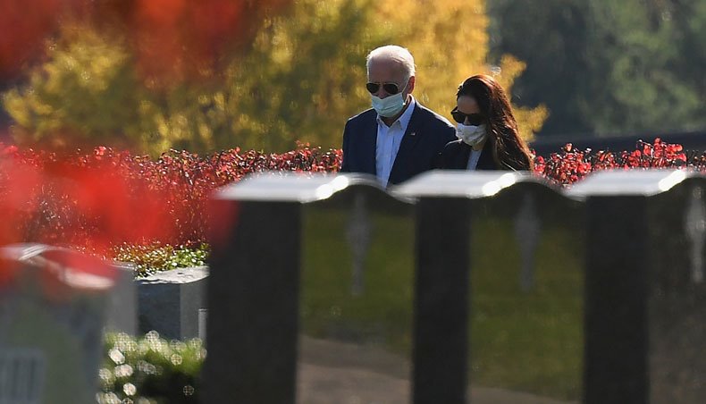 resident-elect Joe Biden and his daughter Ashley Biden leave after visiting their family grave site at St Joseph on the Brandywine Roman Catholic Church in Wilmington, Delaware on November 8, 2020. — AFP photo