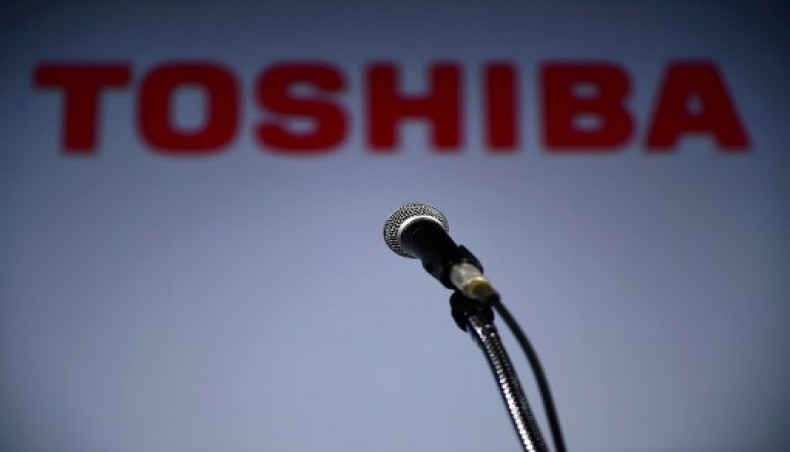 This file photo taken on November 8, 2018 shows a microphone set in front of a logo of Toshiba prior to the company's press conference in Tokyo.-AFP photo