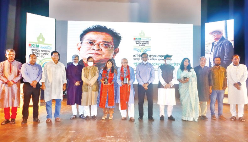 Organisers along with guests and award recipients pose for a photo at the awards ceremony for EXIM Bank-Anyadin Humayun Ahmed Literary Award 2020 at Abdul Karim Sahitya Bisharad Auditorium of Bangla Academy on Thursday.— Sourav Lasker.