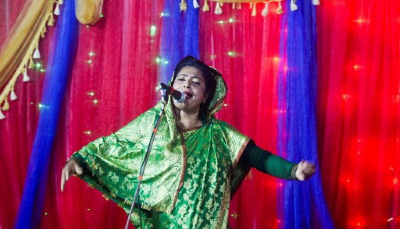 In this picture taken on November 2, 2020, Sufi singer Rita Dewan performs during a concert at a shrine in Dohar. For years Sufi singer Rita Dewan captivated millions of followers in Bangladesh with her haunting ballads, but nowadays she lives in fear each performance will be her last.