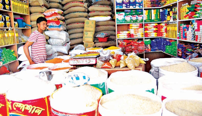A file photo shows a trader waiting for customers at a shop at Demra in the capital. Prices of rice, edible oil and the coarse variety of red lentil increased on the kitchen markets in the city over the week ending on Friday. Prices of rice, edible oil and the coarse variety of red lentil increased on the kitchen markets in the city over the week ending on Friday. — Focusbangla photo