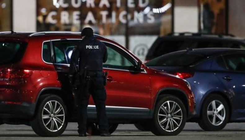 Police officers investigate the area at the Mayfair Mall in Wauwatosa, Wisconsin, on November 20, 2020. — AFP photo