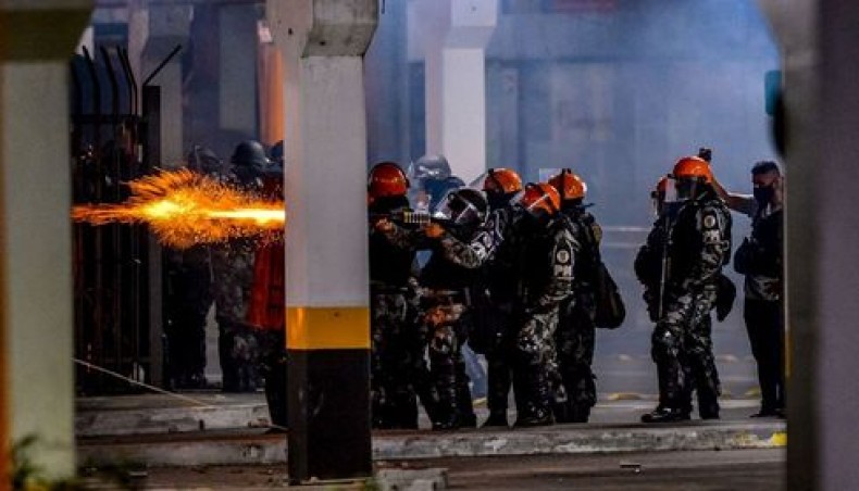 Brazilian military police clash with demonstrators during a protest at the entrance of a Carrefour supermarket where Joao Alberto Silveira Freitas was beaten to death, in Porto Alegre, Rio Grande do Sul, Brazil, on November 20, 2020. — AFP photo