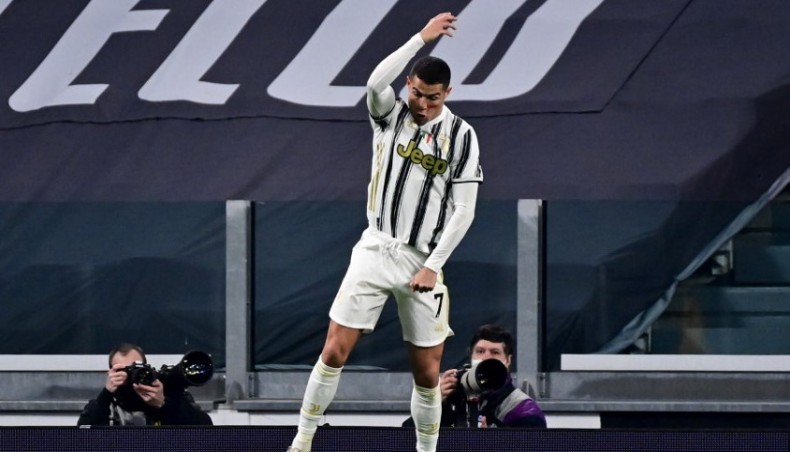 Juventus forward Cristiano Ronaldo celebrates after scoring his second goal against Cagliari during their Serie A match at the Juventus stadium in Turin on Saturday. — AFP photo