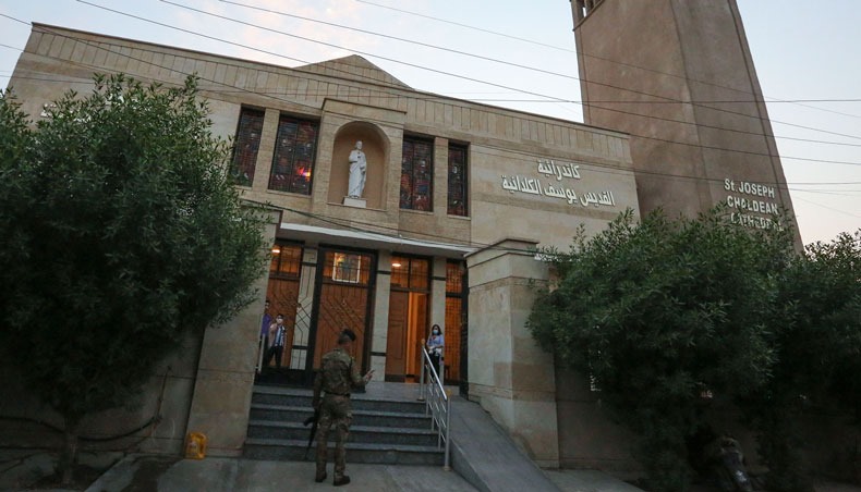 A member of security forces stands guard at the entrance of the Chaldean Church of St Joseph in the Iraqi capital Baghdad, on November 7, 2020. — AFP photo