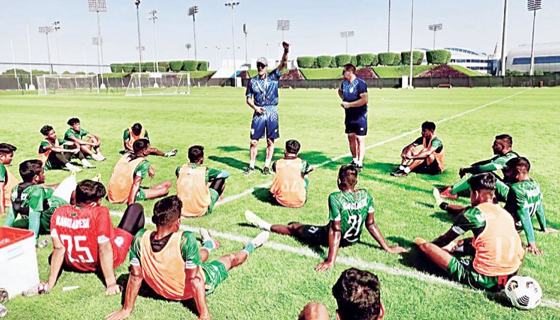Bangladesh national team players listen to assistant coach Stuart Watkiss (C) during a training session at the Al Aziziyah Boutique ground in Doha, Qatar on Sunday. — BFF photo