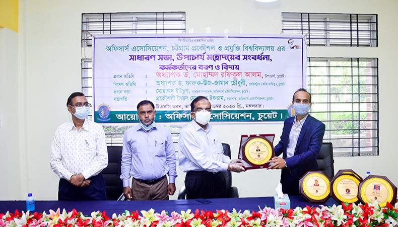 Chattogram University of Engineering and Technology vice-chancellor Mohammad Rafiqul Alam receives a crest from CUET Officers Association president Syed Mohammad Ikram at the TSC auditorium of the university on Tuesday. — Press release