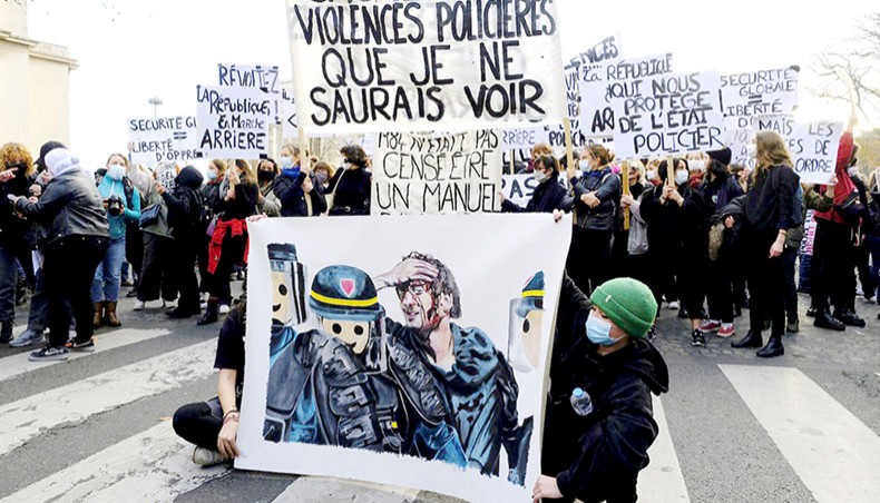 Journalist union members and Gilets Jaunes protesters mark the second anniversary of their movement protest against the global security law on Place du Trocadero near the Eiffel Tower on November 21. — PA Images/Alfred Yaghobzadeh