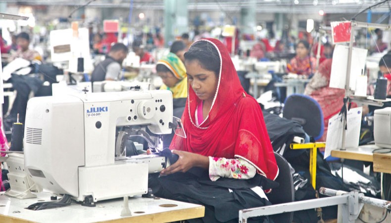 A file photo shows workers sewing clothes at a readymade garment factory on the outskirts of Dhaka. The National Board of Revenue has issued guidelines on contract manufacturing to ease the process of production and supply of goods under the system and facilitate compliance with the value-added tax law by the parties involved.— New Age photo