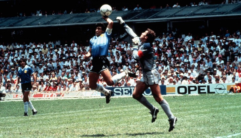 A file photo from June 22, 1986 shows Argentine football legend Diego Maradona punches the ball past England goalkeeper Peter Shilton to score his team's opening goal during their FIFA World Cup quarter-final match at the Azteca Stadium in Mexico City. -- Twitter photo