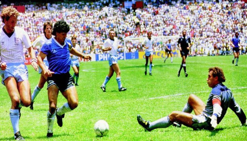 A file photo from June 22, 1986 shows Argentine football legend Diego Maradona (2nd-L) goes round England goalkeeper Peter Shilton to score his team's second goal during their World Cup quarter-final match at the Azteca Stadium in Mexico City.-- Twitter photo