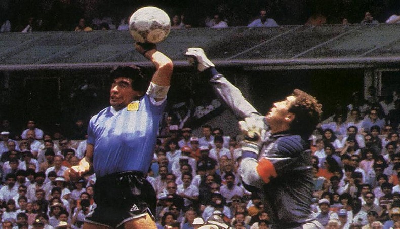 Diego Maradona scores with his hand against England in 1986 World Cup.- Courtesy Daily Telegraph, UK