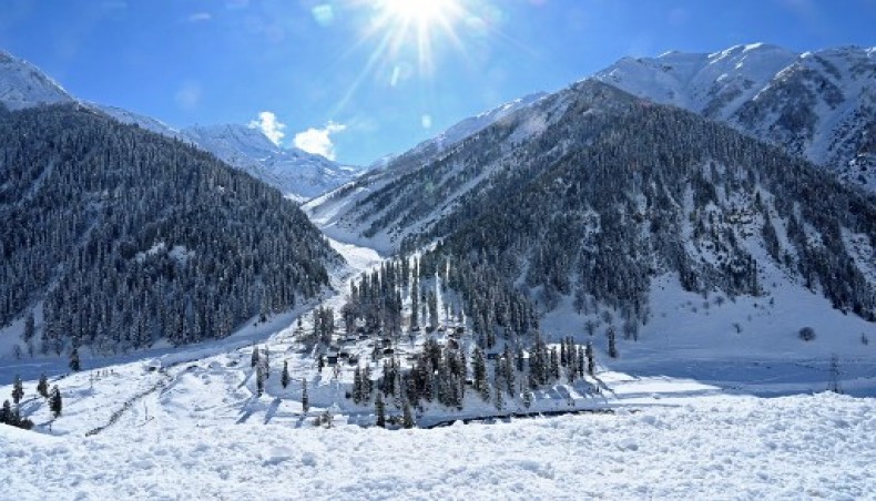 Snow covered mountains and houses are seen at Baltal that connects Srinagar to the union territory of Ladakh, bordering China on November 26, 2020. — AFP File Photo