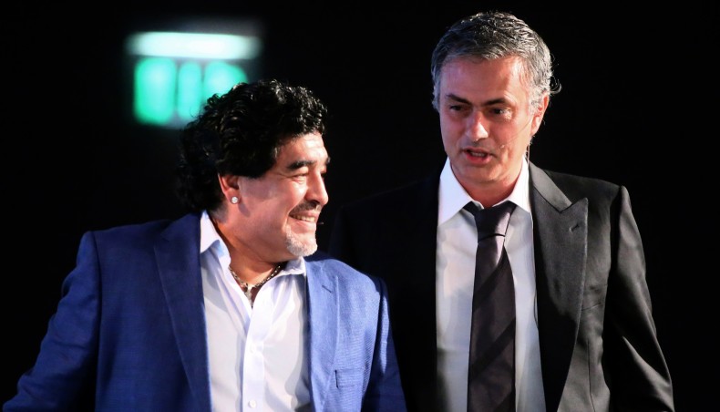 A file photo shows Argentine football legend Diego Maradona sharing a light moment with current Tottenham Hotspur manager Jose Mourinho.-- AFP photo