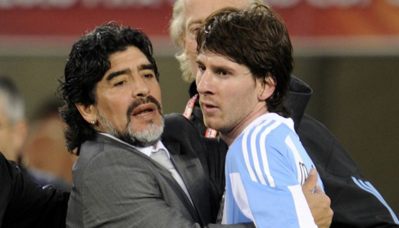 This file photo from July 03, 2010 shows Argentina coach Diego Maradona hugging striker Lionel Messi after their 2010 World Cup quarter-final against Germany in Cape Town. —AFP photo
