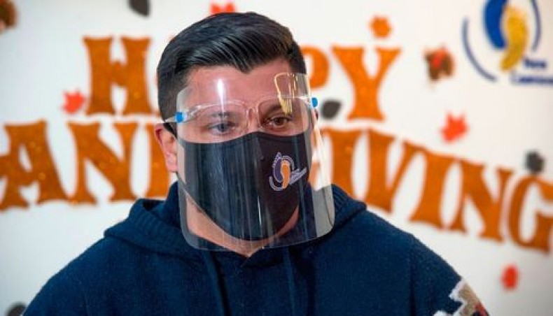 The president of the NGO New Comienzos, Israel Concha, speaks during a Thanksgiving dinner prepared by the NGO for Mexican deported migrants, in Mexico City, on November 25, 2020. — AFP photo
