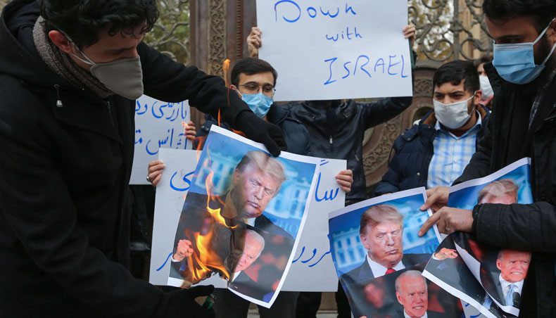 Students of Iran’s Basij paramilitary force burn posters depicting US president Donald Trump and president-elect Joe Biden, during a rally in front of the foreign ministry in Tehran, on November 28, 2020, to protest the killing of prominent nuclear scientist Mohsen Fakhrizadeh a day earlier near the capital. — AFP photo