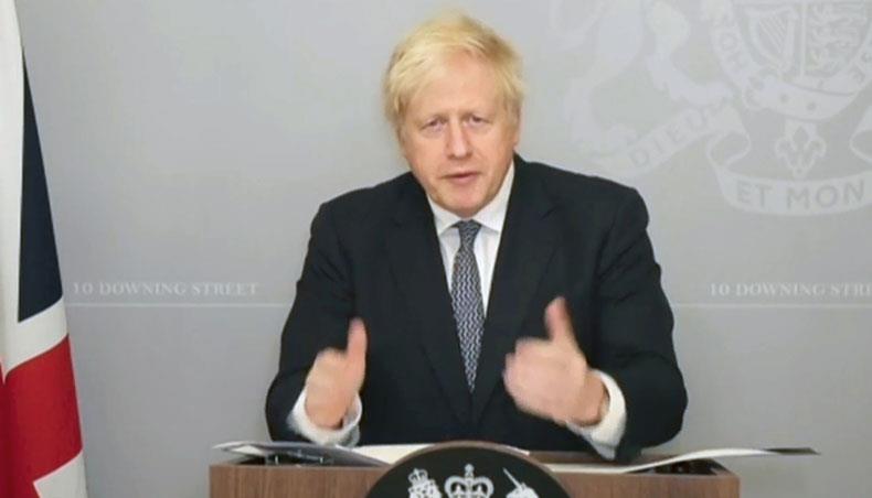 A video grab from footage broadcast by the UK Parliament’s Parliamentary Recording Unit shows Britain’s prime minister Boris Johnson remotely updating MPs on the COVID-19 pandemic, in a hybrid, socially distanced session at the House of Commons in London on November 23, 2020. — AFP photo