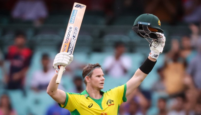 Australia's Steve Smith celebrates his century against India during their second one-day international match at the Sydney Cricket Ground in Sydney on Sunday. — AFP photo