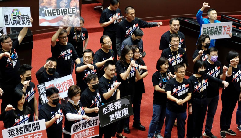 Legislators from the main opposition Kuomintang display placards reading ‘feed people with Ractopamine pork’ to ask prime minister Su Tseng-chang to step down during a demonstration at the Parliament in Taipei on November 27, 2020. — AFP Photo