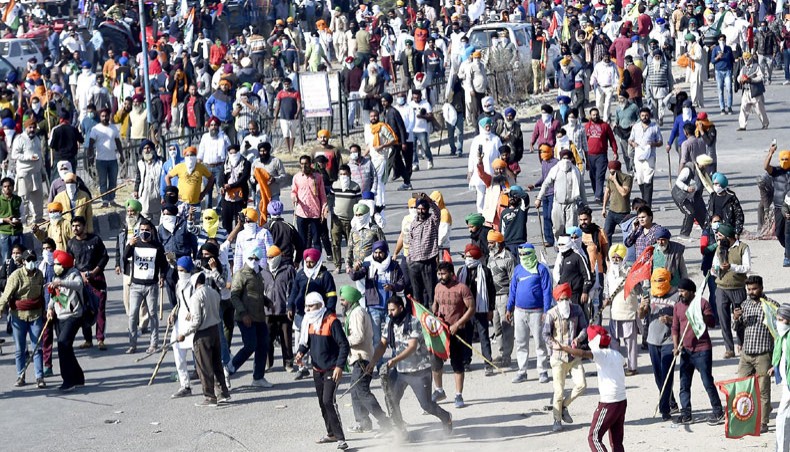 Farmers gather as they try to march to New Delhi to protest against the central government’s recent agricultural reforms at the Delhi-Haryana border in Kundli on November 27. — Agence France-Presse/Money Sharma