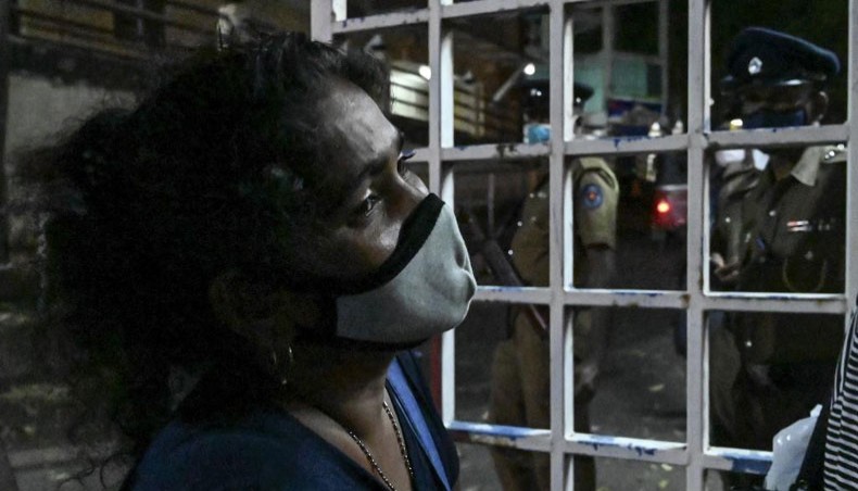 A relative of an inmate weeps at Ragama hospital on the outskirts of Colombo on November 30, 2020 a day after a prison riot over the surge of COVID-19 infections.— AFP Photo