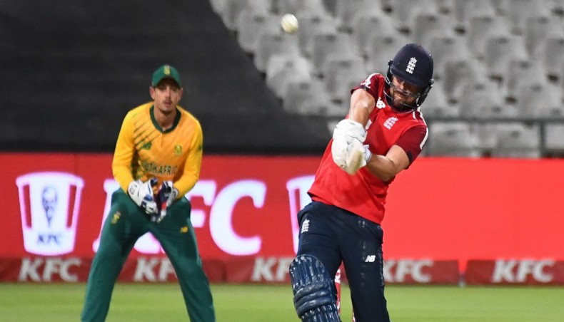 England's Dawid Malan (R) hits a six during their third T20 international match against South Africa at the Newlands stadium in Cape Town on Tuesday. — AFP photo