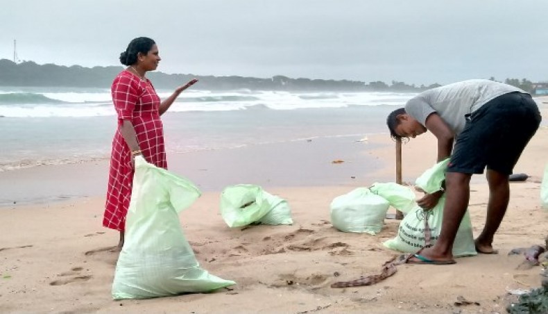 Residents prepare sand bags to protect their homes ahead of cyclone Burevi landfall in Sri Lanka's north-eastern coast, in Trincomalee on December 2, 2020.